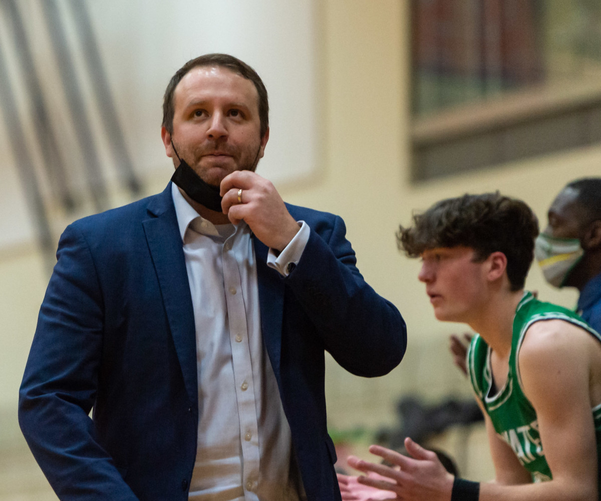 Tumwater coach Josh Wilson looks at the clock in a Lower Columbia College's Martin Luther King Jr. Tribute game on Monday, Jan. 17, 2022, at Myklebust Gymnasium in Longview. Tumwater won 64-52 over Mark Morris. (Joshua Hart/For ScorebookLive)