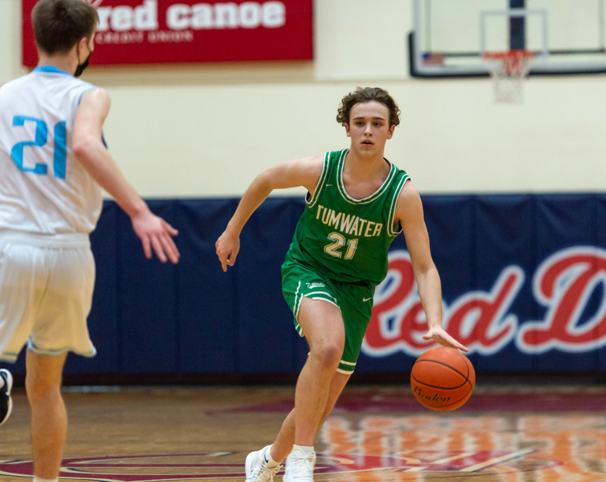Tumwater's Connor Hopkins dribbles in transition in a Lower Columbia College's Martin Luther King Jr. Tribute game on Monday, Jan. 17, 2022, at Myklebust Gymnasium in Longview. Tumwater won 64-52 over Mark Morris. (Joshua Hart/For ScorebookLive)