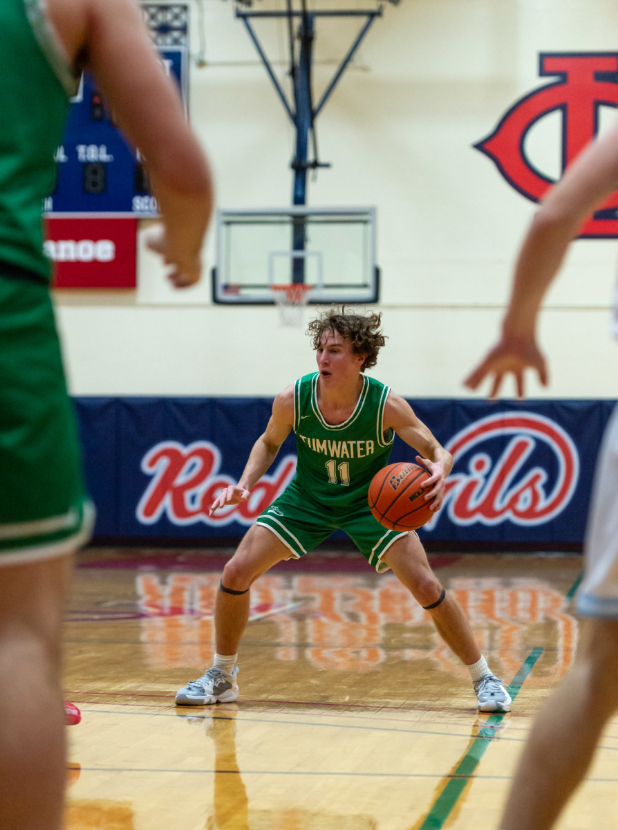 Tumwater's Luke Brewer dribbles in a Lower Columbia College's Martin Luther King Jr. Tribute game on Monday, Jan. 17, 2022, at Myklebust Gymnasium in Longview. Tumwater won 64-52 over Mark Morris. (Joshua Hart/For ScorebookLive)