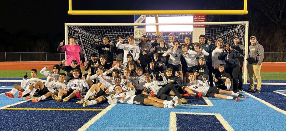 The New Hope Trojans celebrate their 5A North State Championship after defeating Ridgeland High 2-1 Tuesday night in Ridgeland. (Photo courtesy New Hope Soccer)