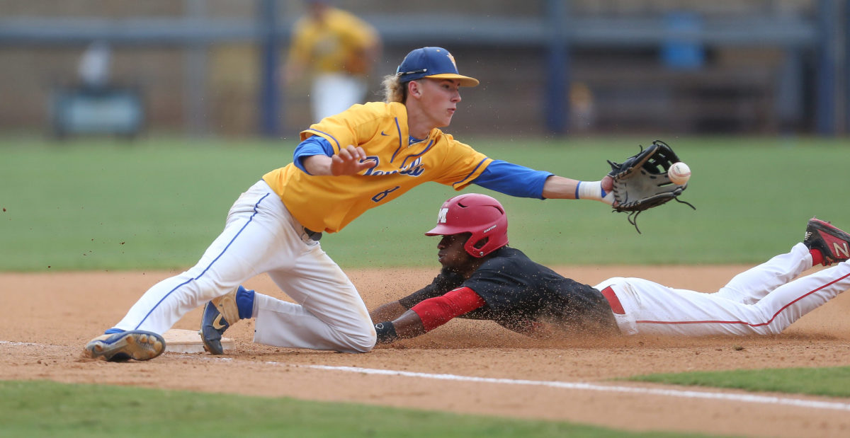 Booneville's John Adam White (8) reaches for the ball while attempting to tag out Magee's Chandler Pittman (1). Booneville and Magee played in game 1 of the MHSAA Class 3A Baseball Championship on Tuesday, June 1, 2021 at Trustmark Park. Photo by Keith Warren