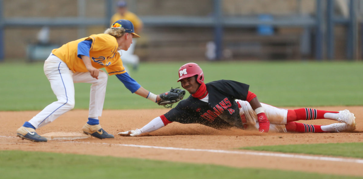 Magee's Brennon McNair (4) is tagged out at third base by Booneville's John Adam White (8). Booneville and Magee played in game 1 of the MHSAA Class 3A Baseball Championship on Tuesday, June 1, 2021 at Trustmark Park. Photo by Keith Warren