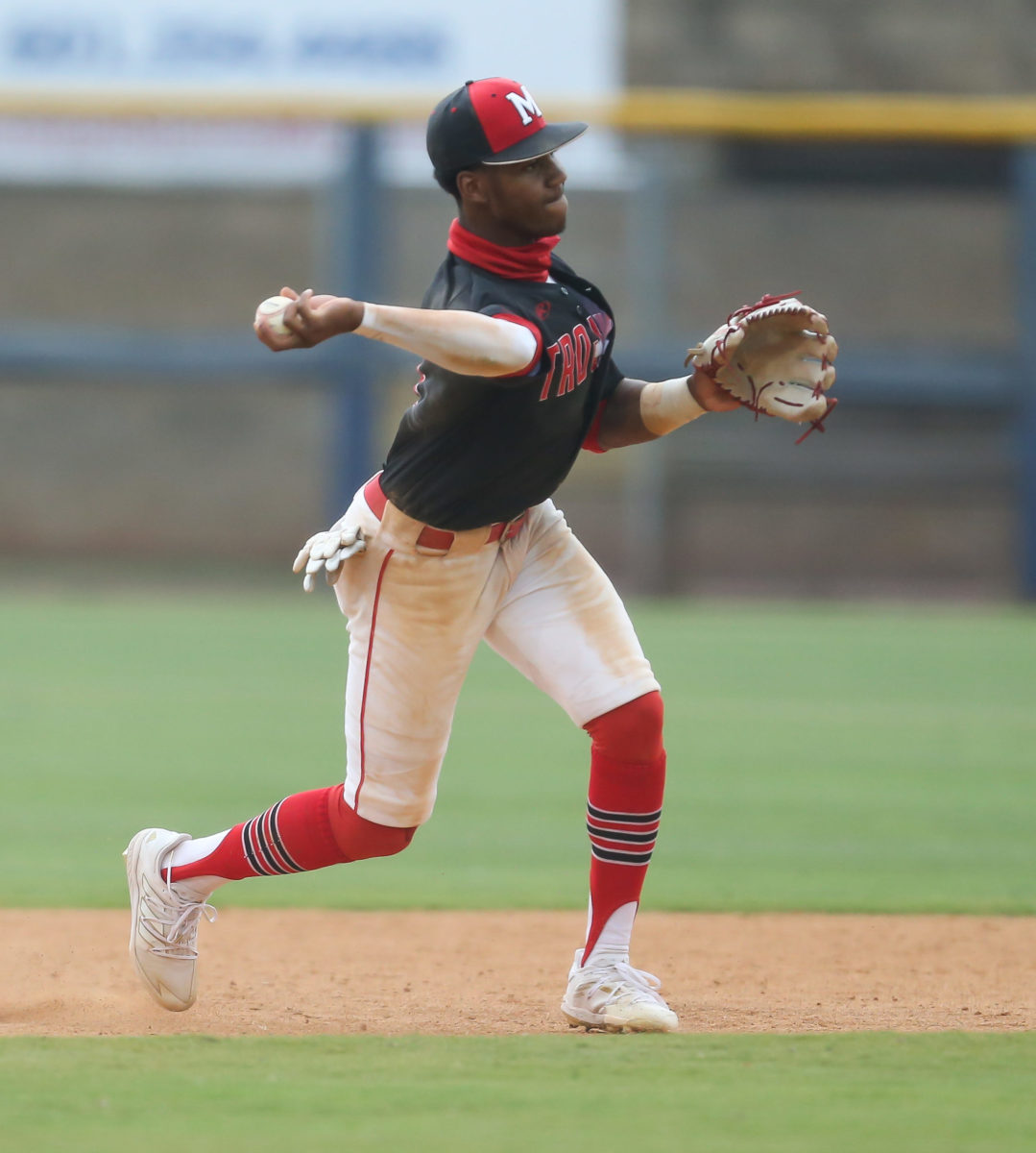 Magee's Brennon McNair (4) makes a throw to first base for an out. Booneville and Magee played in game 1 of the MHSAA Class 3A Baseball Championship on Tuesday, June 1, 2021 at Trustmark Park. Photo by Keith Warren