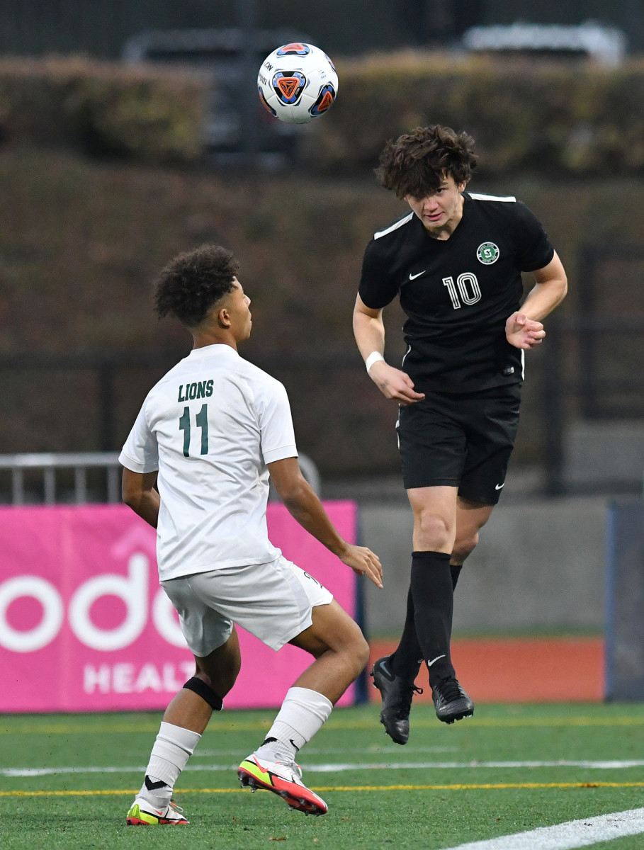 Summit senior Paul Fecteau heads the ball Saturday, Nov. 13, 2021, during the Storm’s 6-0 win against West Linn in the OSAA 6A Boy’s state championship game at Hillsboro Stadium in Hillsboro.