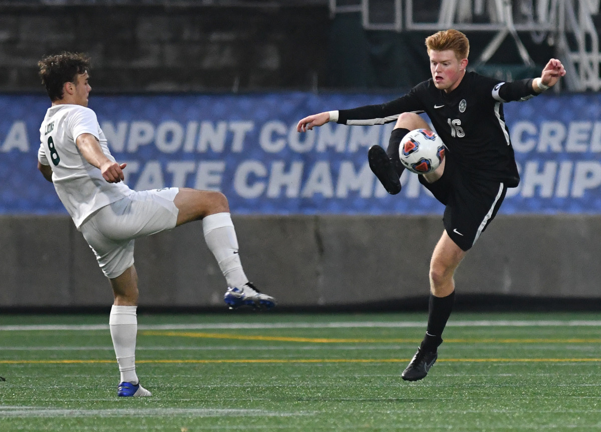 Summit senior Rory McKee, right, controls the ball Saturday, Nov. 13, 2021, during the StormÕs 6-0 win against West Linn in the OSAA 6A BoyÕs state championship game at Hillsboro Stadium in Hillsboro.