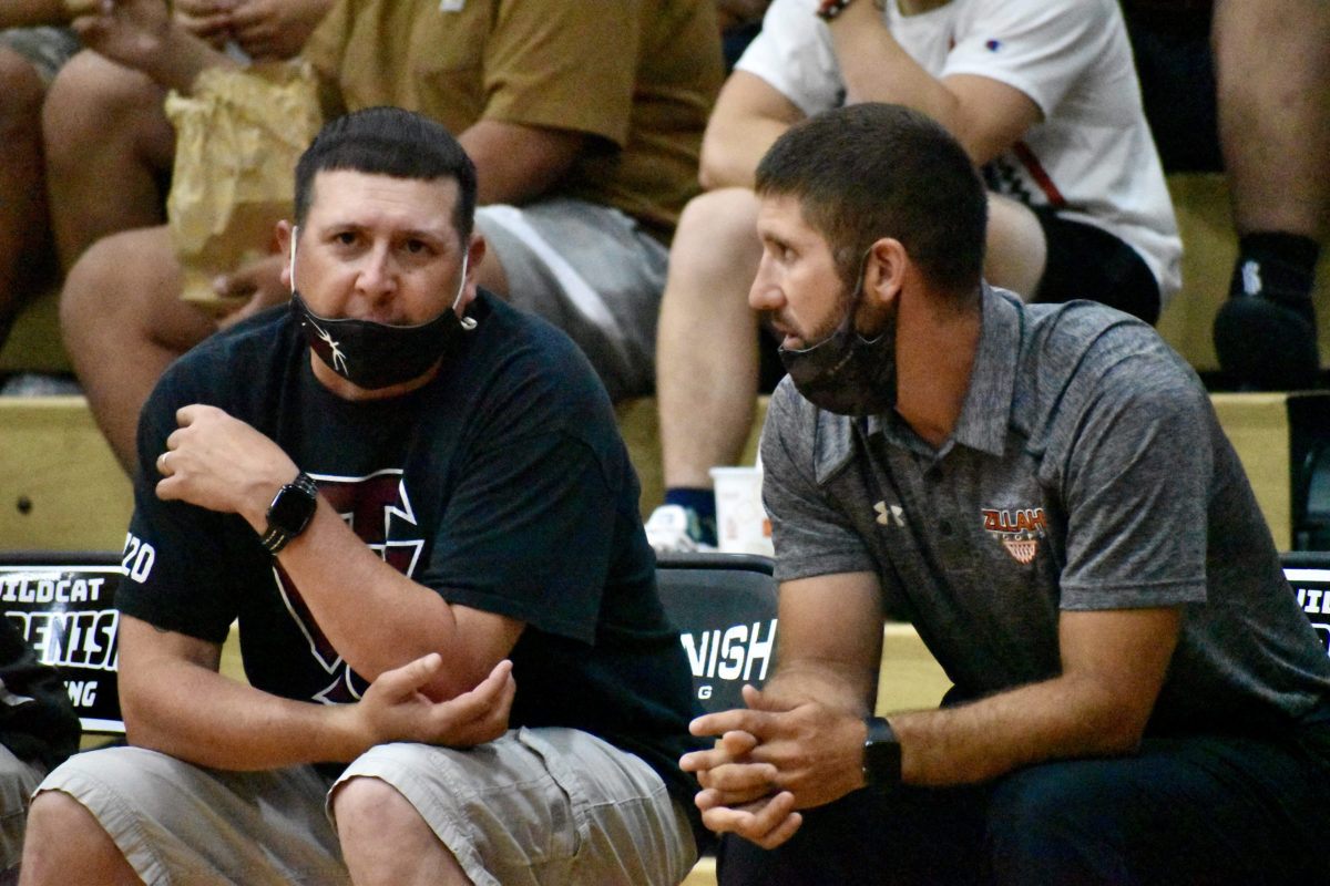 Toppenish coach Jojo Mesplie (left) and Zillah's Mario Mengarelli (right) chat pregame. (Photo by Andy Buhler)