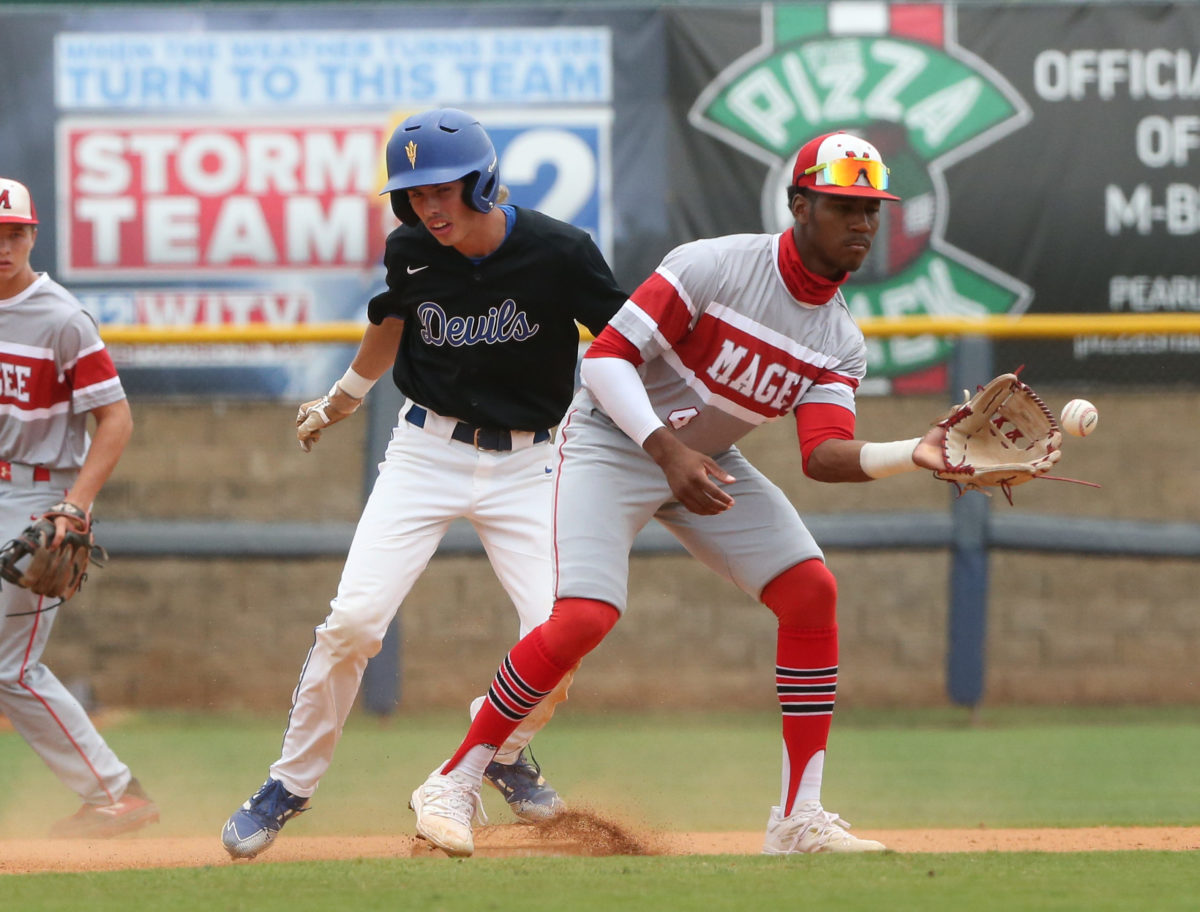 Booneville's Kyle Church (7) makes it safely to second base as Magee's Brennon McNair (4) awaits the throw. Booneville and Magee played in game 3 of the MHSAA Class 3A Baseball Championship on Saturday, June 5, 2021 at Trustmark Park. Photo by Keith Warren