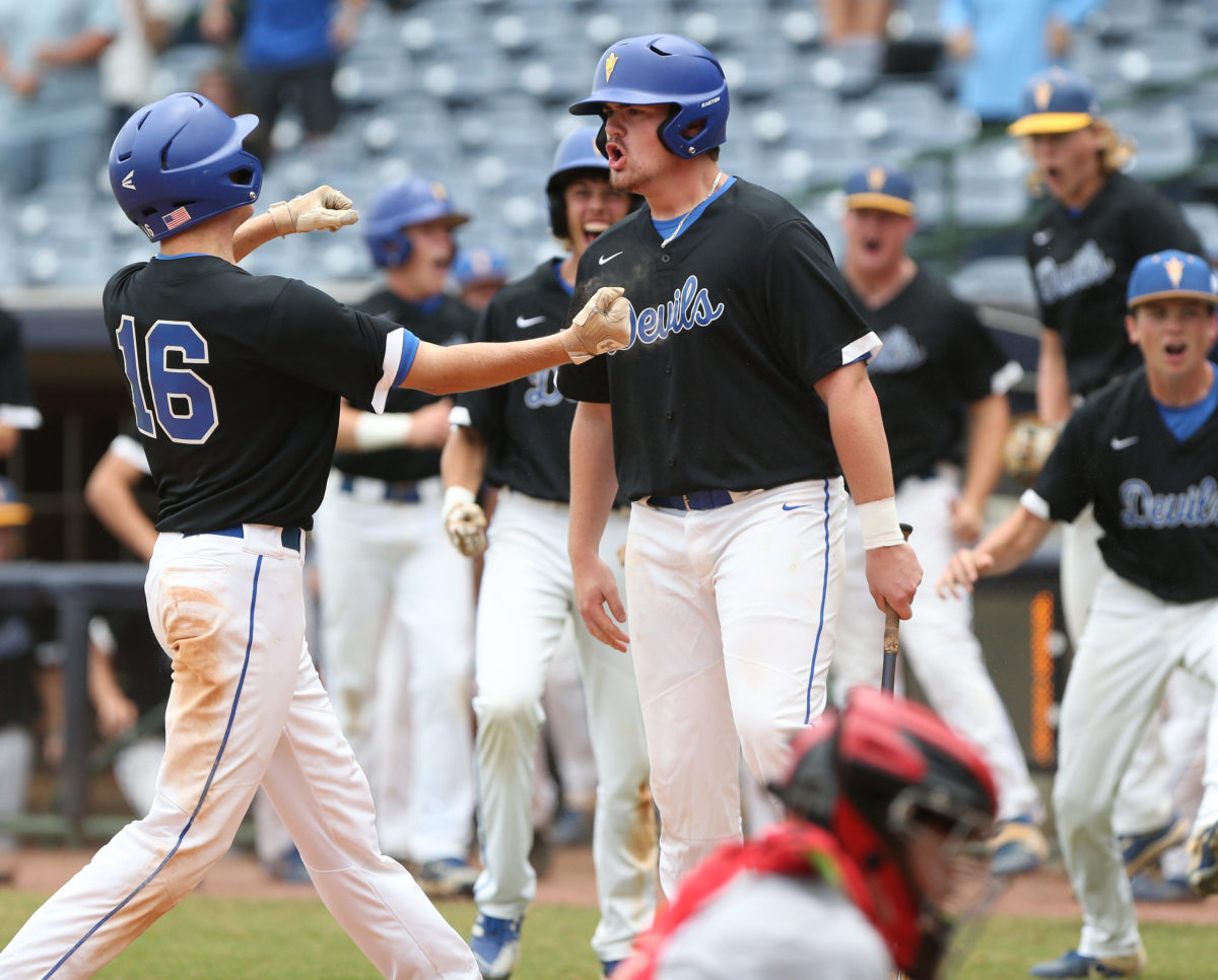 Booneville's John Daniel Deaton (16) celebrates with his teammates after scoring a run. Booneville and Magee played in game 3 of the MHSAA Class 3A Baseball Championship on Saturday, June 5, 2021 at Trustmark Park. Photo by Keith Warren