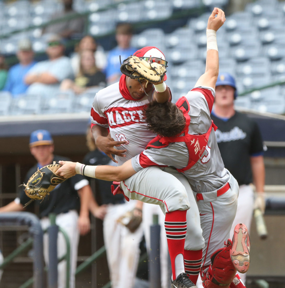 Magee's Chance Magee (18) and Magee's Banks Teater (3) collide while trying to catch a foul ball. Booneville and Magee played in game 3 of the MHSAA Class 3A Baseball Championship on Saturday, June 5, 2021 at Trustmark Park. Photo by Keith Warren