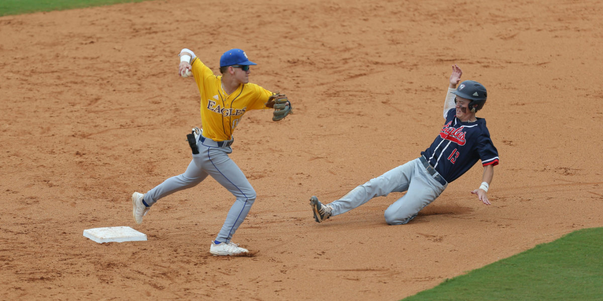 Resurrection's Will Clemens (00) tags second base as Tupelo Christian's John Paul Yates (13) slides. Tupelo Christian and Resurrection played in game 2 of the MHSAA Class 1A Baseball Championship on Thursday, June 3, 2021 at Trustmark Park. Photo by Keith Warren