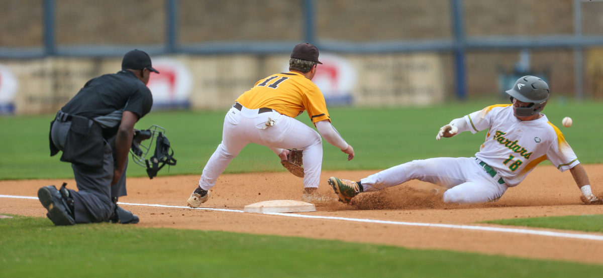 Taylorsville's Kelby Jordan (18) slides safely into third base. East Union and Taylorsville played in game 2 of the MHSAA Class 2A Baseball Championship on Friday, June 4, 2021 at Trustmark Park. Photo by Keith Warren