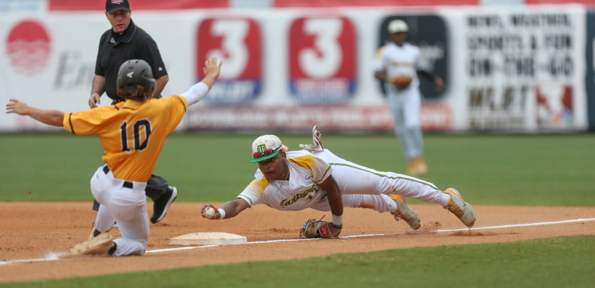 Taylorsville's Aiden Moffett (23) attempts to beat East Union's Jude Treadaway (10) to first base. East Union and Taylorsville played in game 2 of the MHSAA Class 2A Baseball Championship on Friday, June 4, 2021 at Trustmark Park. Photo by Keith Warren