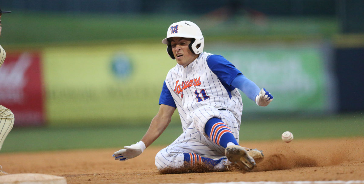 Madison Central's Connor Nation (11) slides into third base. Madison Central and Northwest Rankin played in game 1 of the MHSAA Class 6A Baseball Championship on Thursday, June 4, 2021 at Trustmark Park. Photo by Keith Warren