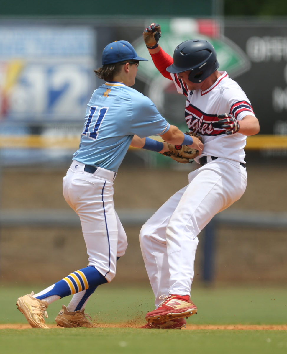 Resurrection's Luke Schnoor (11) tags Tupelo Christian's Cooper Davis (33) for an out at second base. Tupelo Christian and Resurrection played in game 1 of the MHSAA Class 1A Baseball Championship on Tuesday, June 1, 2021 at Trustmark Park. Photo by Keith Warren