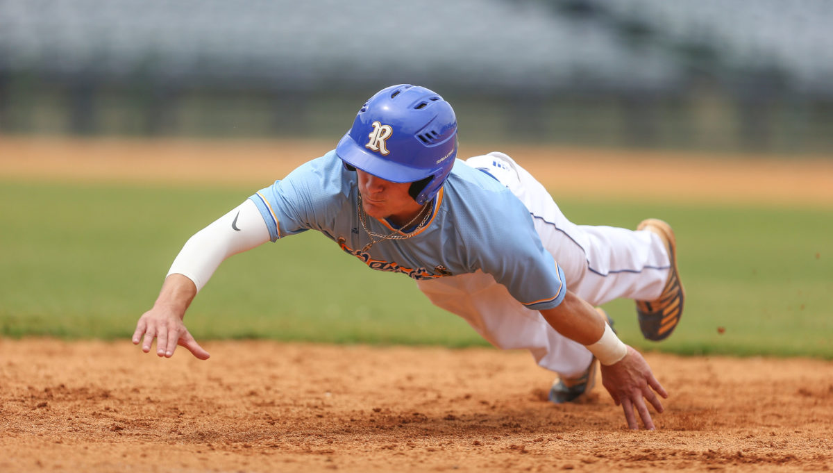 Resurrection's Miller Kay (4) dives back  to first base. Tupelo Christian and Resurrection played in game 1 of the MHSAA Class 1A Baseball Championship on Tuesday, June 1, 2021 at Trustmark Park. Photo by Keith Warren