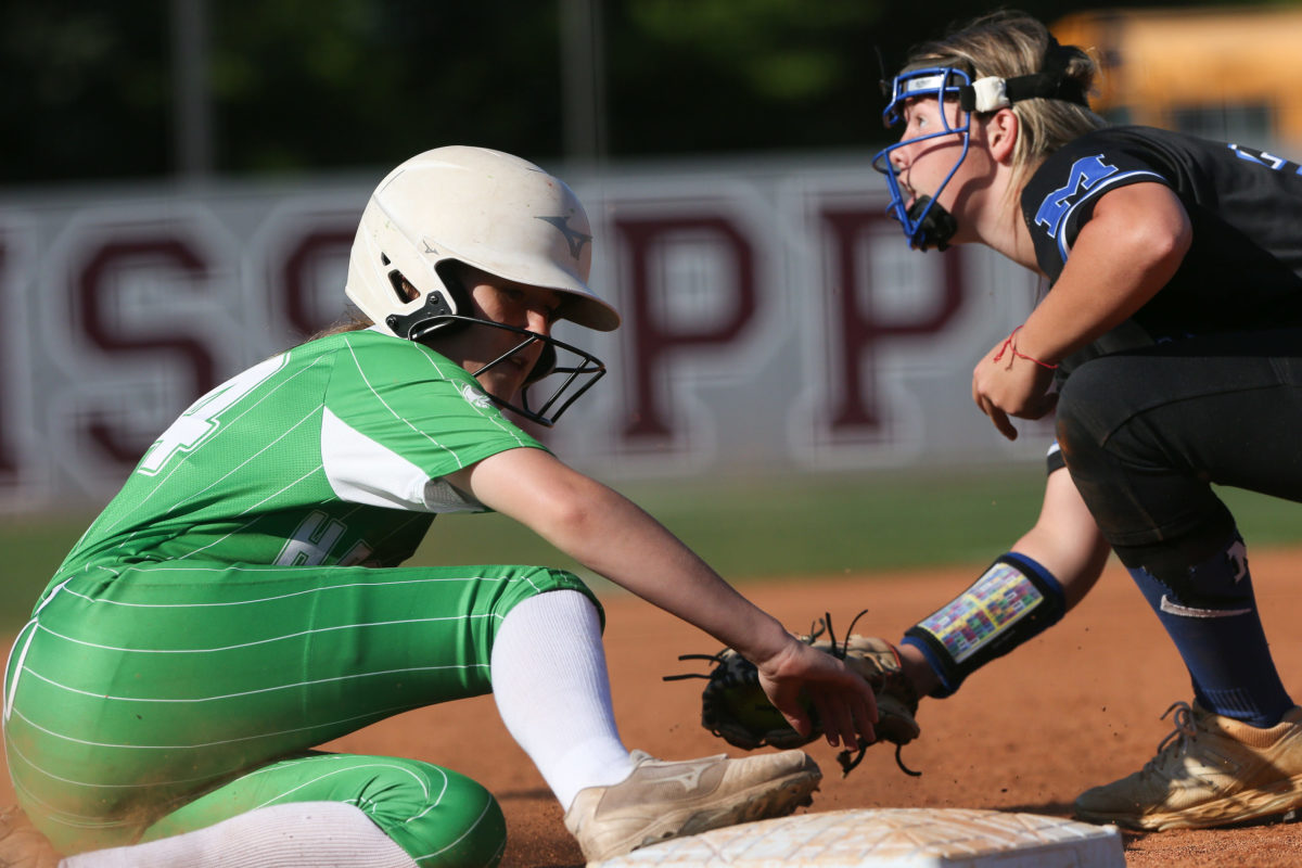 Mantachie High School's Allie  Ensey  (30) tags out Lake High School's Taylor Clark (14) at third base. Mantachie and Lake played in game one of the MHSAA Class 2A Baseball Championship at Mississippi State University on Wednesday, May 12, 2021. Photo by Keith Warren