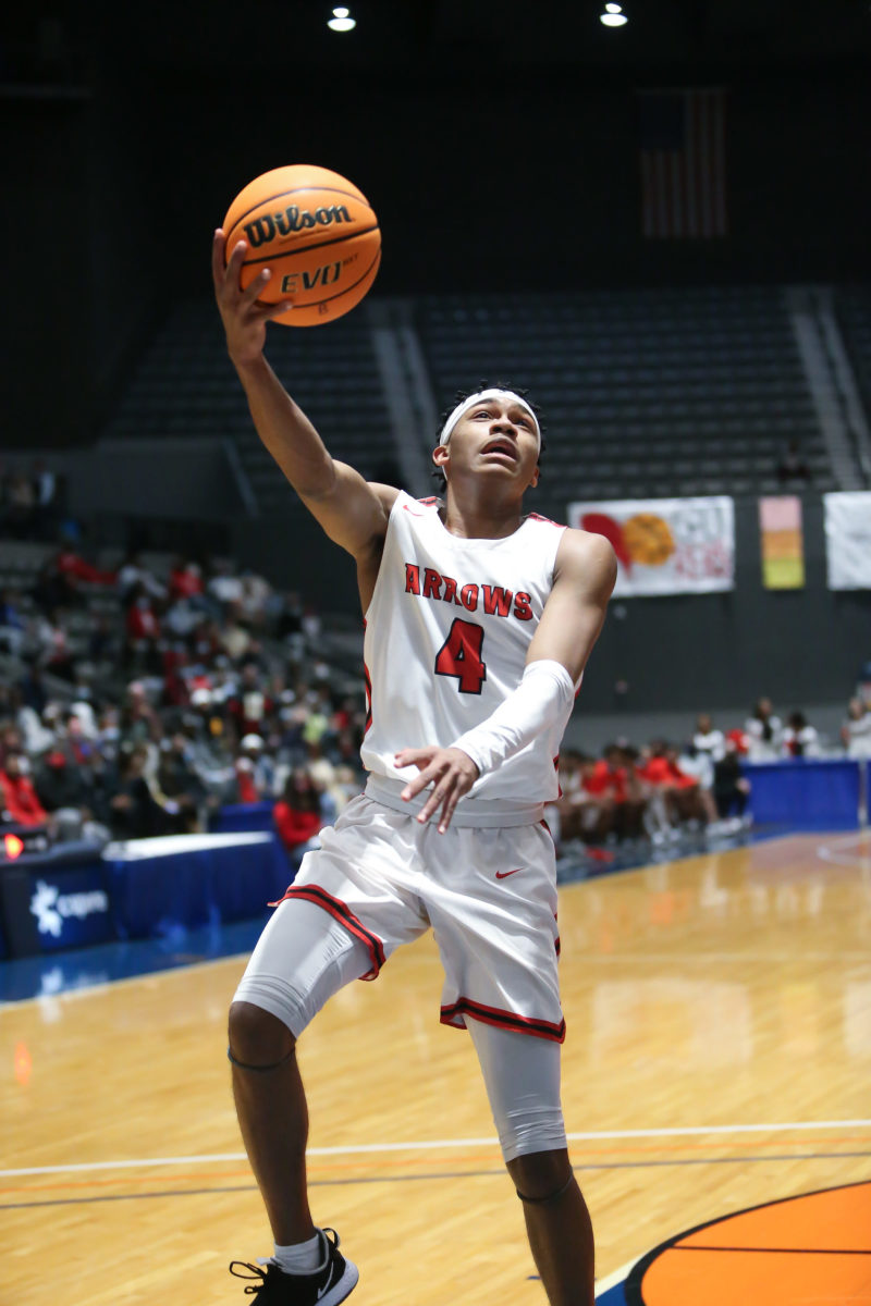 Clinton's Allen Hughes (4) scores in the lane. Clinton and Harrison Central played in an MHSAA Class 6A basketball semifinal basketball game at Mississippi Coliseum on Wednesday, March 3, 2020. Photo by Keith Warren