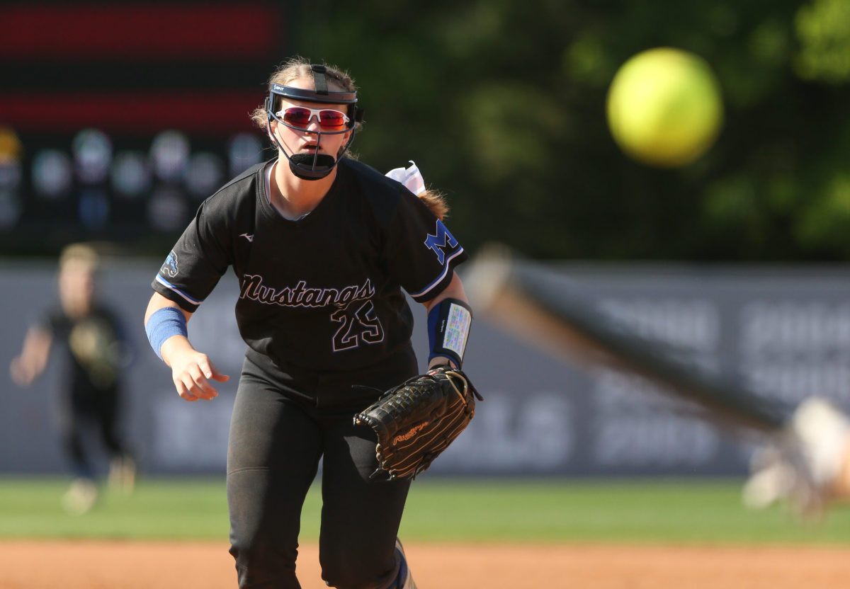Mantachie High School's Lillianna Cates (25) charges to the plate. Mantachie and Lake played in game one of the MHSAA Class 2A Baseball Championship at Mississippi State University on Wednesday, May 12, 2021. Photo by Keith Warren