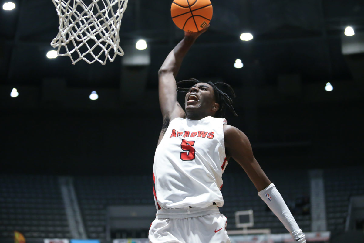 Clinton's Kimani Hamilton (5) attempts a dunk in the third quarter. Clinton and Harrison Central played in an MHSAA Class 6A basketball semifinal basketball game at Mississippi Coliseum on Wednesday, March 3, 2020. Photo by Keith Warren