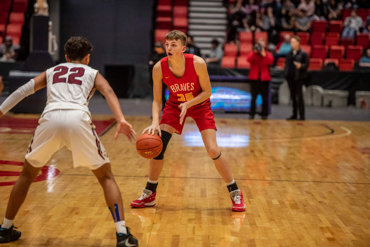 Bilodeau dribbles in a District 8 playoff game against Mt. Spokane in Feb. 2020, his sophomore year. (Scott Butner photo)