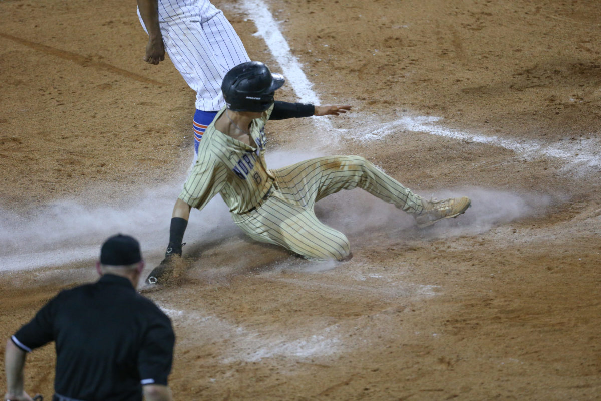 Northwest Rankin's Nick Monistere (8) scores in the fourth inning to give Northwest Rankin a 1-0 lead. Madison Central and Northwest Rankin played in game 1 of the MHSAA Class 6A Baseball Championship on Thursday, June 4, 2021 at Trustmark Park. Photo by Keith Warren
