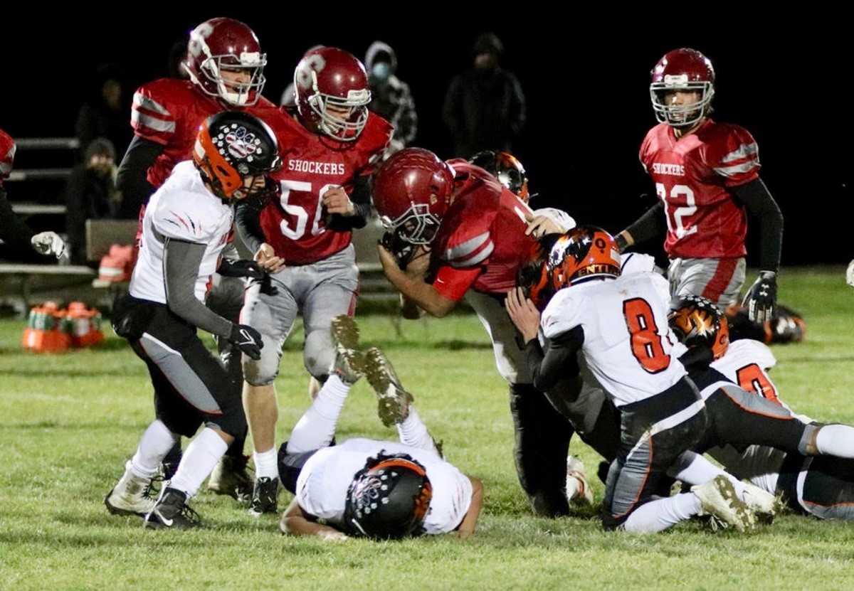 Waterville leading rusher Abraham Diaz is being tackled by a swarm of Entiat defenders in fall of 2021 game.