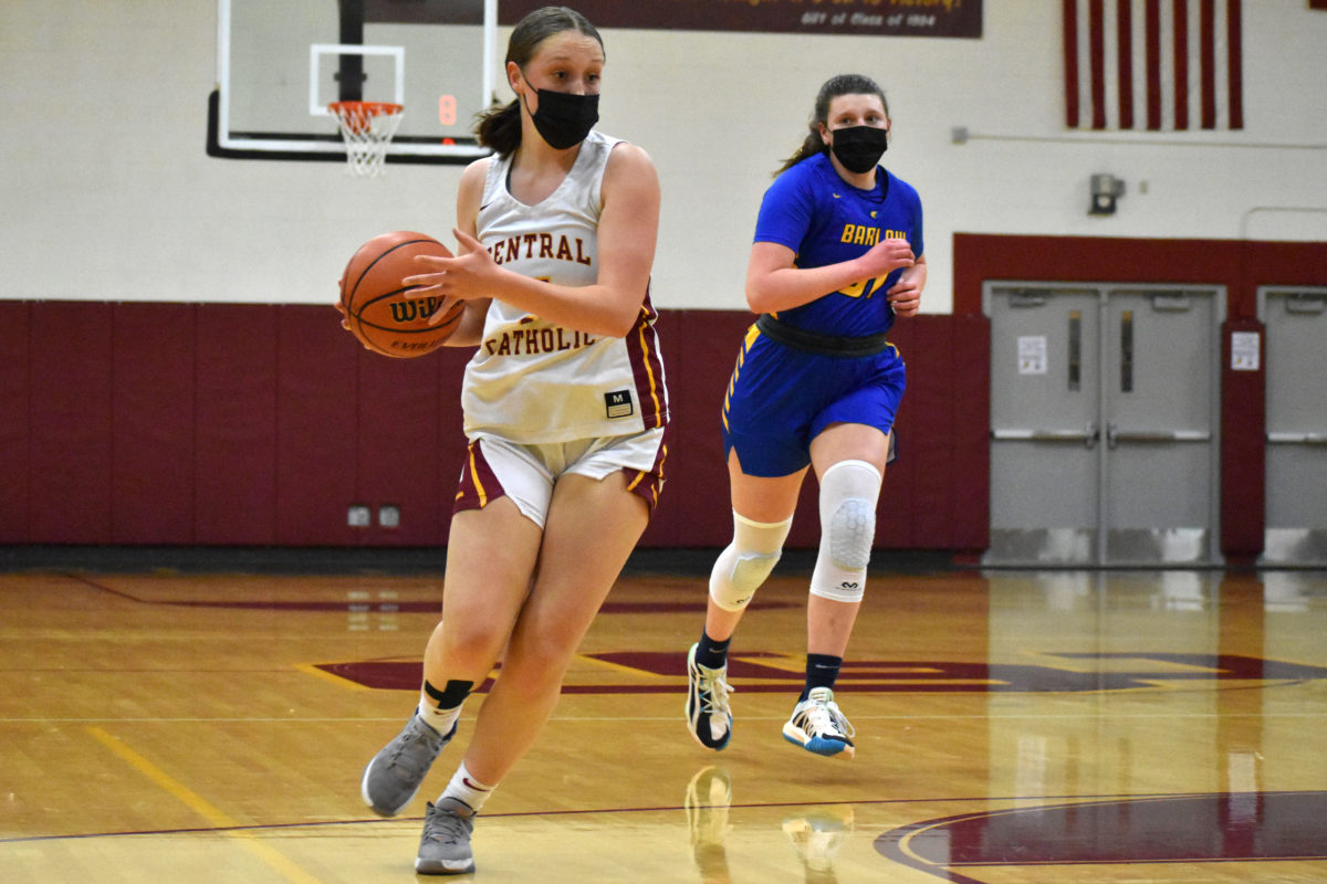 Central Catholic's Fiona Rose Thomas moves into the lane on the fastbreak ahead of Barlow's Rilyn Quirke.