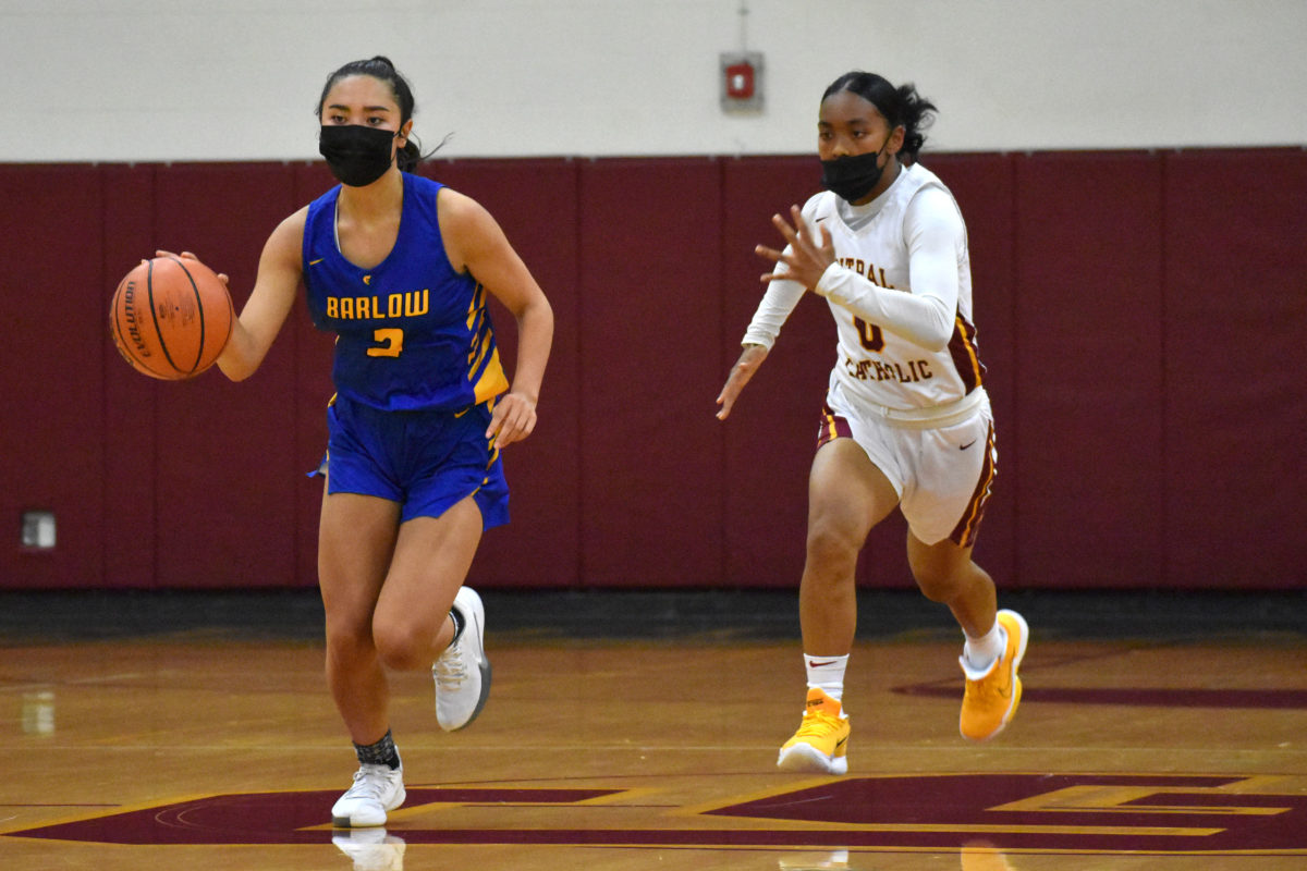 Barlow's Melanie Hiu moves across the center logo after coming up with a steal, while Central Catholic's Jayde Jackson gives chase.