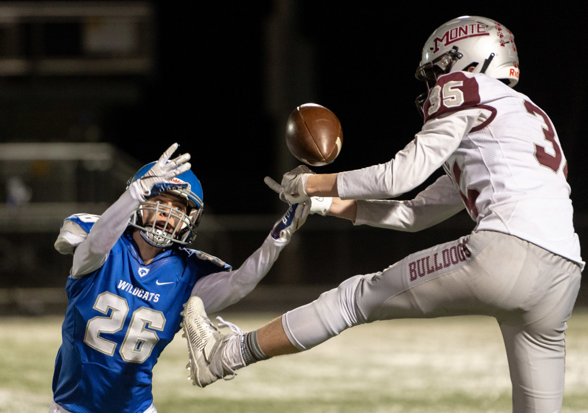 La Center's Colby Hylton and Caydon Lovell compete for a jump ball in a 1A Southwest District playoff game on Friday, Nov. 5, 2021, at Beaver Stadium in Woodland. Montesano won 42-20. (Joshua Hart/For ScorebookLive)