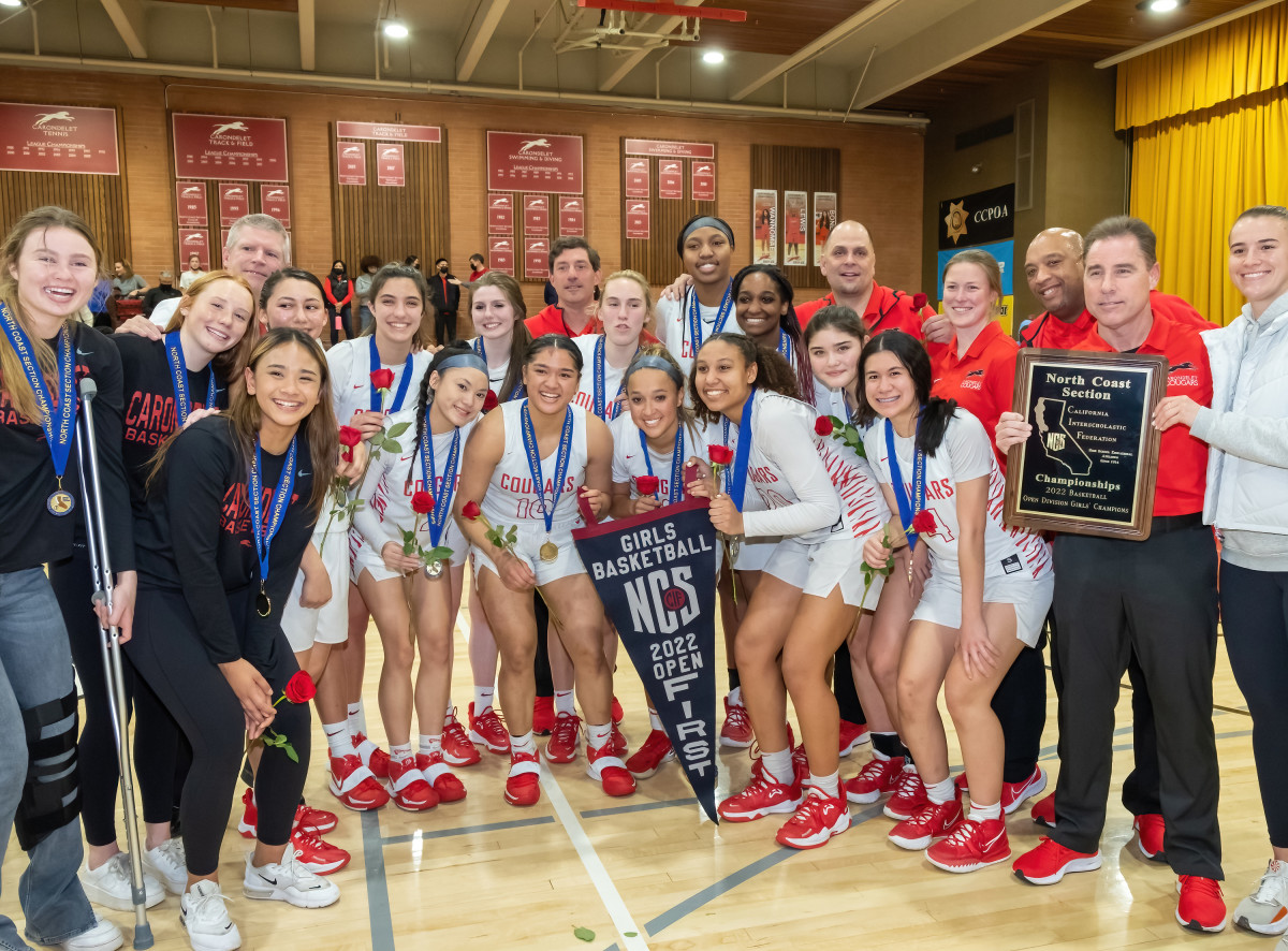 Sabrina Ionescu (far right) celebrates with her former coach Kelly Sopak and rest of Carondelet after winning the NCS 2022 Open Division title