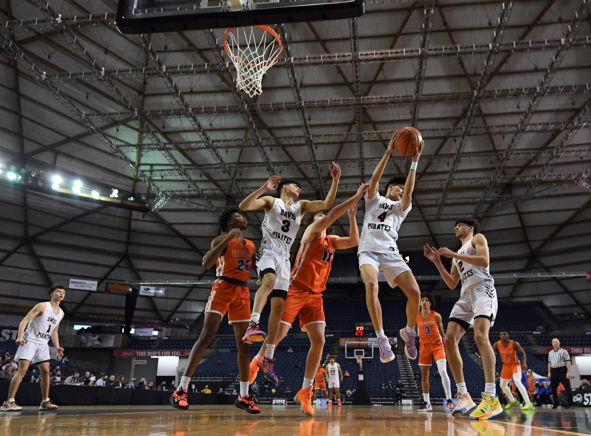 Robert Galindo (No. 4) pulls down a rebound against Graham-Kapowsin in the 4A state playoffs in the Tacoma Dome in March.