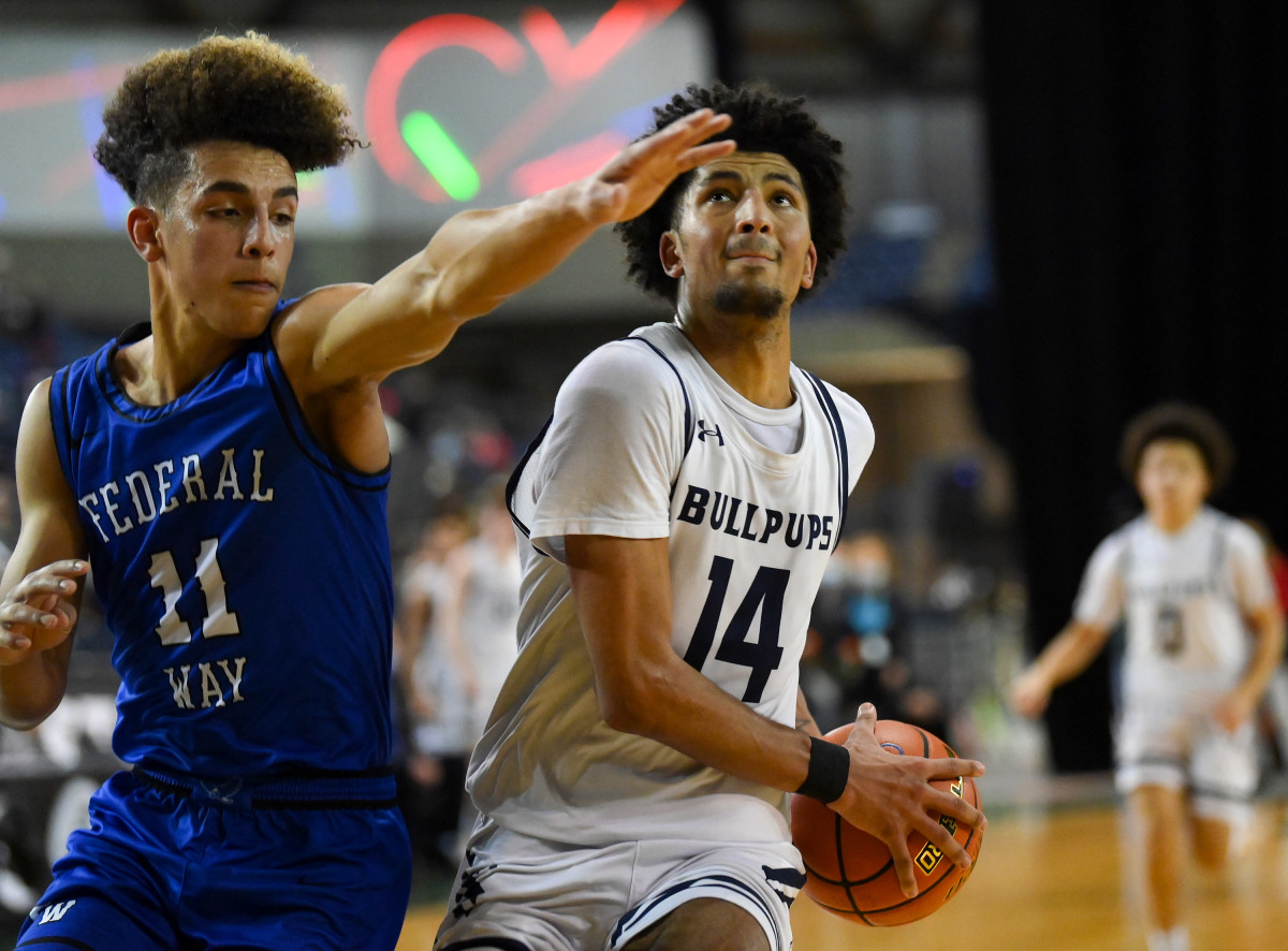 Afework (left) guards Gonzaga Prep forward Jayden Stevens in the 2022 Class 4A state tournament in March.