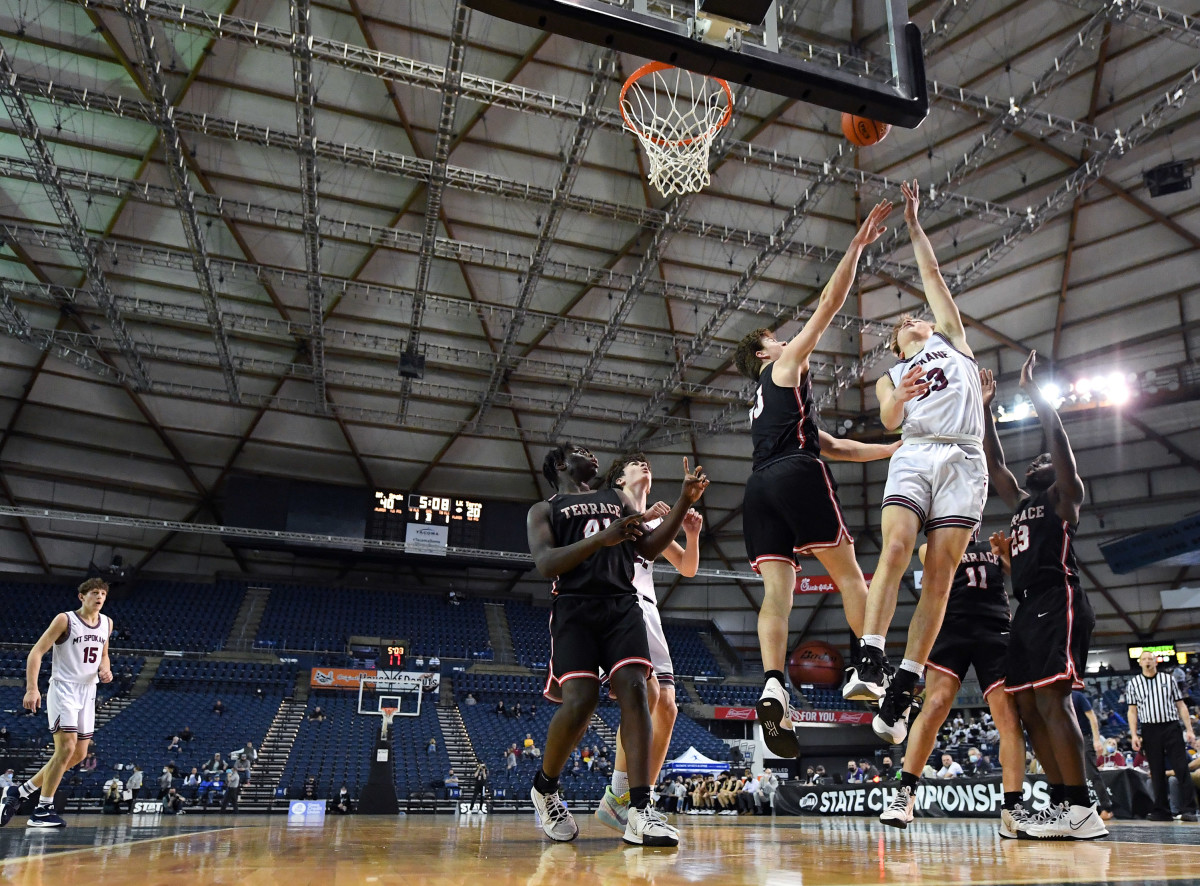 Jones (No. 41, left) boxes out during a Class 3A state tournament game against Mt. Spokane. The sophomore turned many heads with a strong performance in the Tacoma Dome.