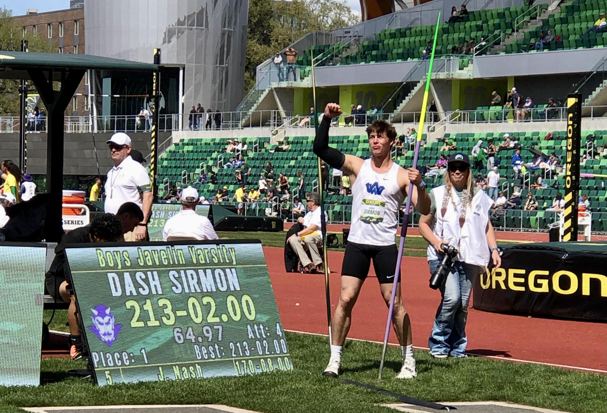 Sirmon pumps his fist toward the crowd at Hayward Field after setting the top mark in the country during the Oregon Relays on Friday in Eugene.