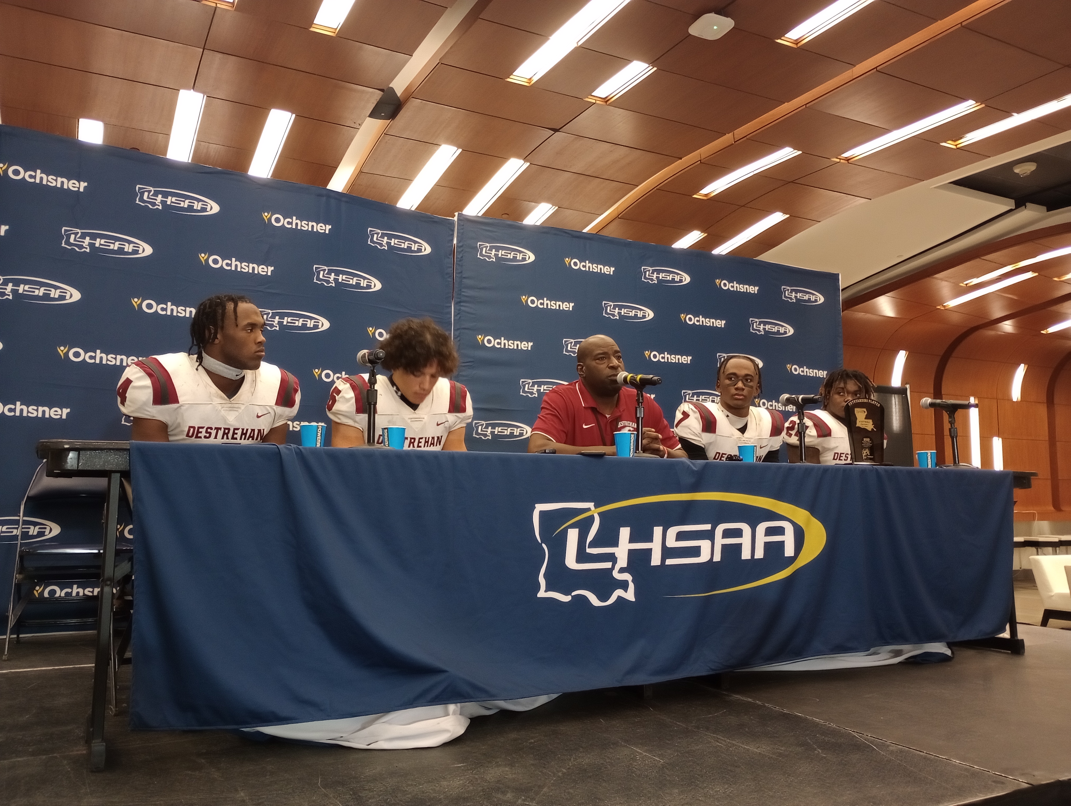 From left, Destrehan's Jai Eugene Jr., Anthony Robinson, coach Marcus Scott, Kevin Adams and Shane Lee following the Wildcats' 17-10 win against Ruston for the Division I non-select title on Dec. 9, 2022.