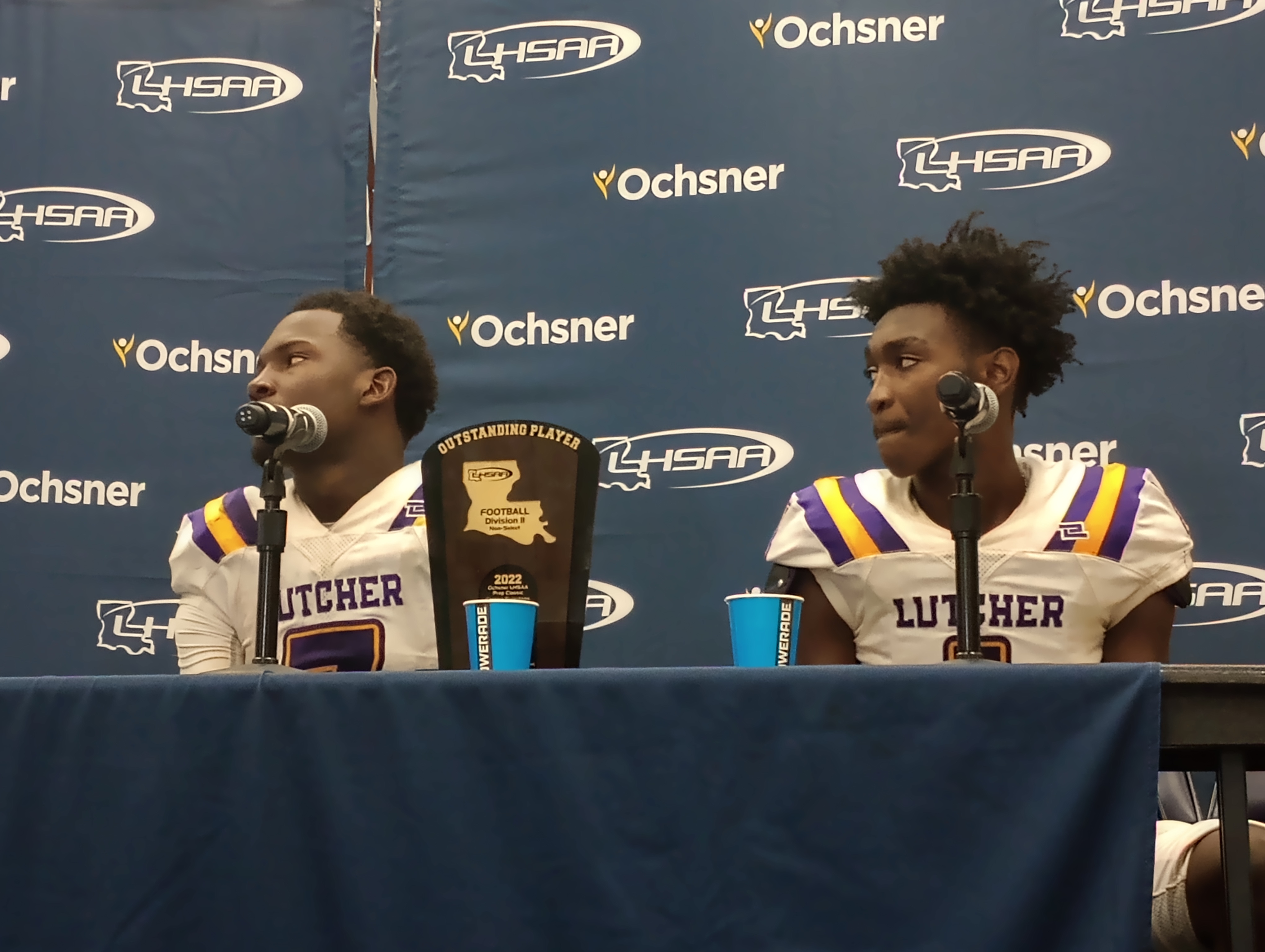 Lutcher QB D'Wanye' Winfield (left) and WR Tylin Johnson postgame after the Bulldogs' 28-25 win against North DeSoto for the Division II non-select championship on Dec. 10, 2022.