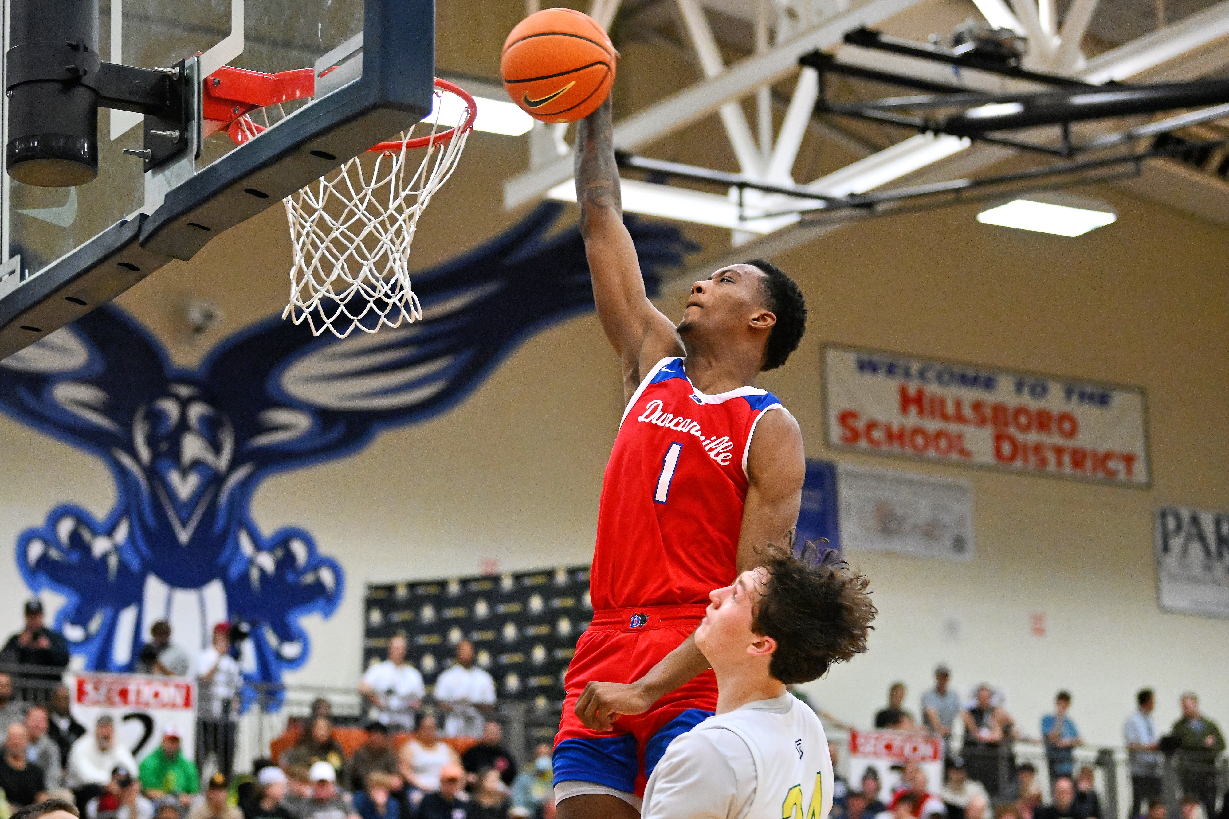 Ron Holland rises above a defender during the Les Schwab Invitational in Oregon in December.