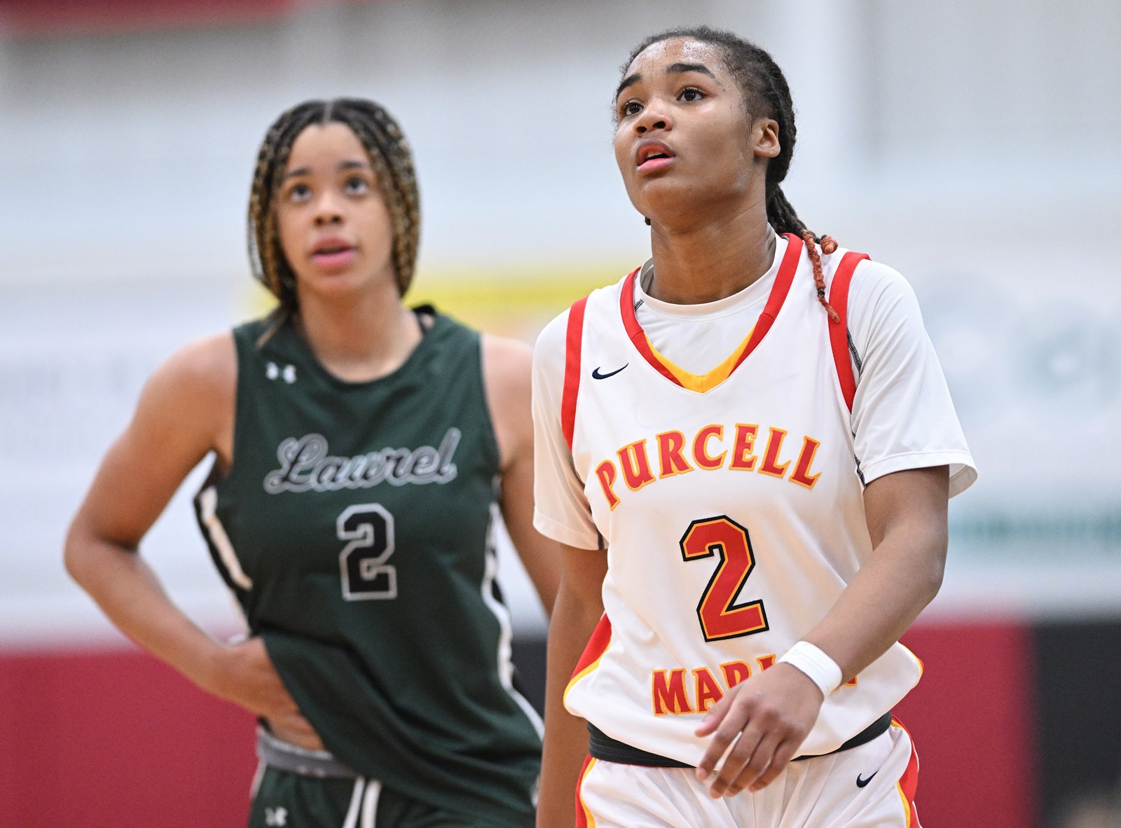 Purcell Marian's Dee Alexander and Laurel's Saniyah Hall look on during a game on January 11, 2023.