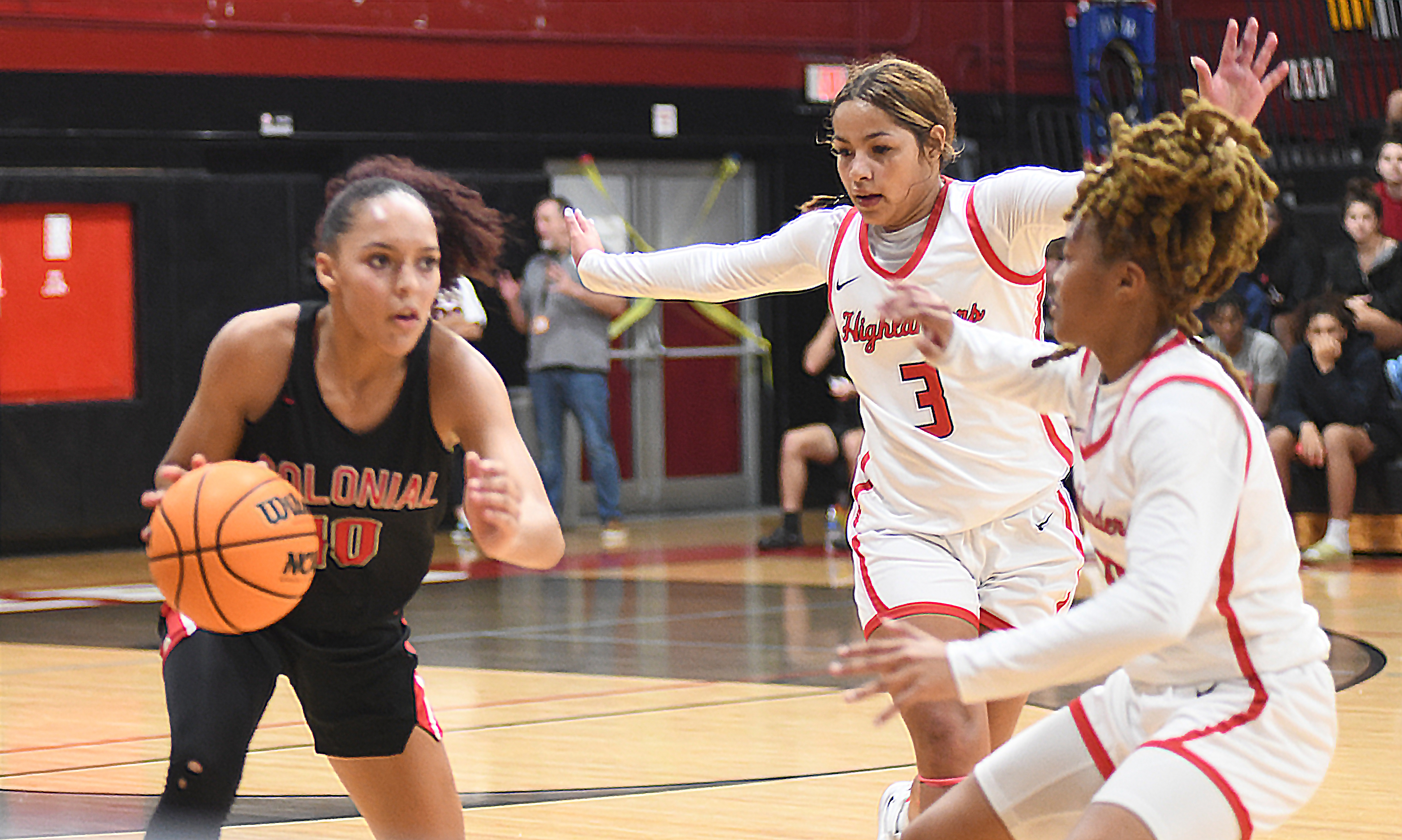 Lake Highland Prep's Camila DePool (3) and Jada Eads, right, press Colonial guard Carmen Richardson during the second half of their nondistrict game. Eads had 22 points and eight rebounds in the Highlanders' 57-52 victory, while DePool added seven points. Richardson had a team-high 16 points.