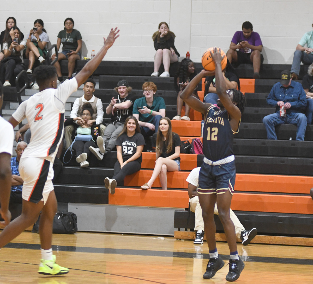 Wekiva's Abiah Charles shoots for a first-half 3-pointer against Leesburg's Camerin James. Charles scored a game-high 15 points, including the go-ahead 3-pointer, in the Mustangs' 45-42 victory. James had 13 points.