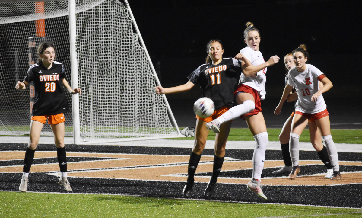 Oviedo High's Hannah Gretkowski (11) fights for a ball in Tuesday night's Class 6A-5 final against Edgewater.