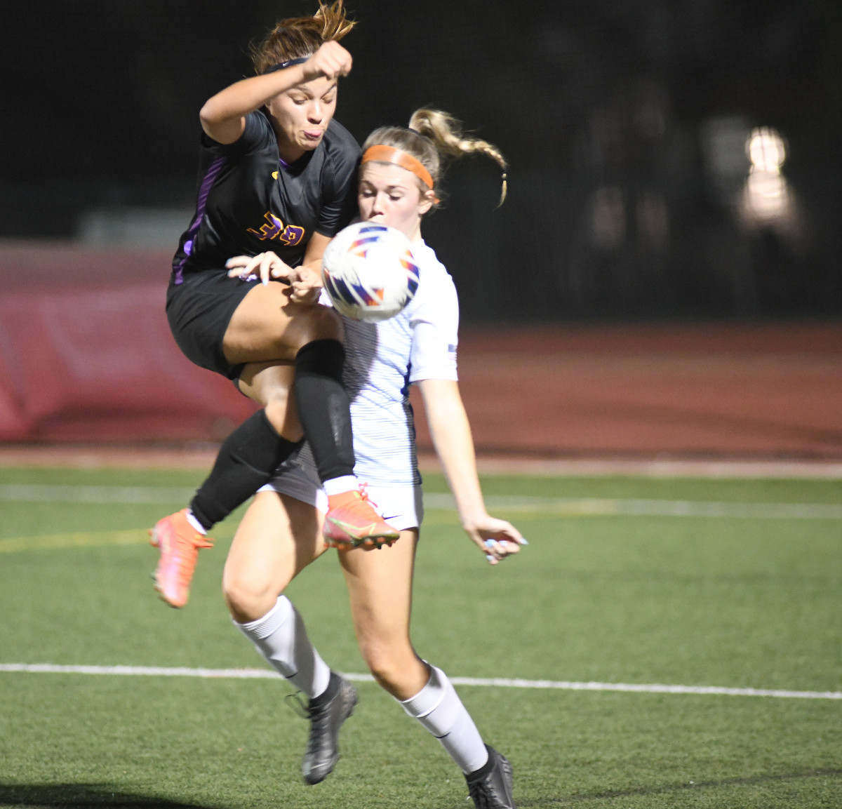 Montverde forward Antonella Mazziotto Duffaut (left) tries to control a pass in front of The First Academy's Hannah Hudson. Mazziotto scored three goals in the Eagles' 5-0 victory.