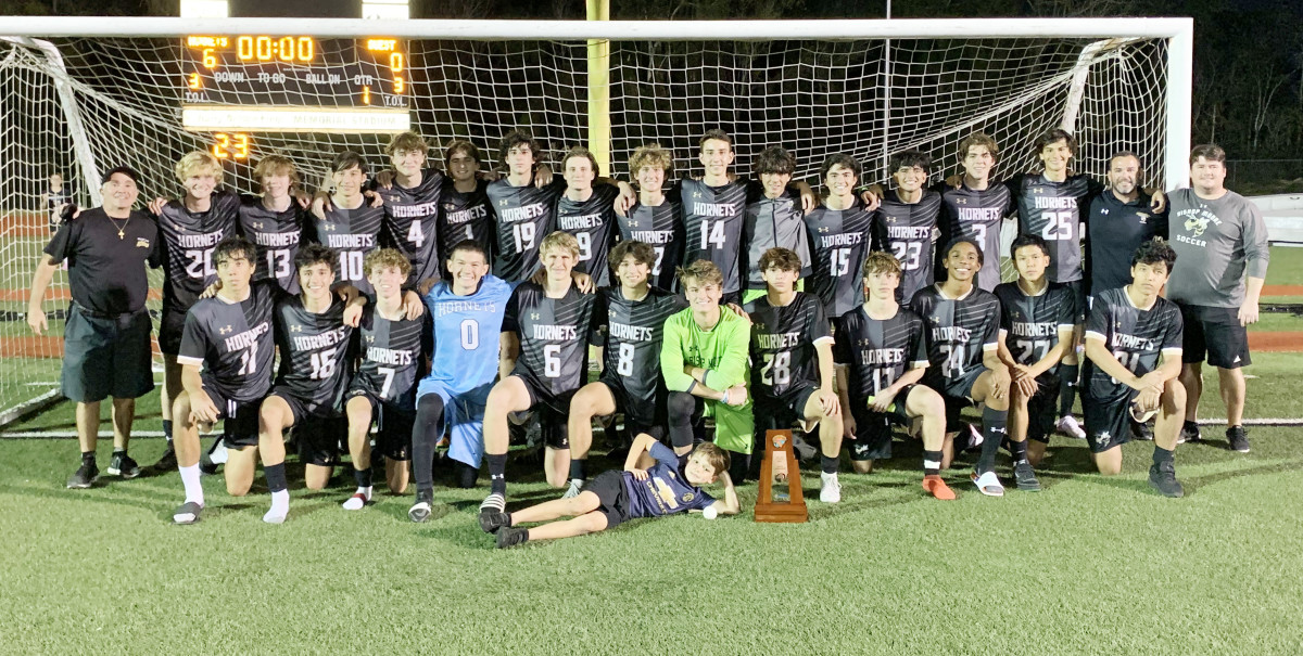 The Bishop Moore boys soccer team celebrates its 2022-23 its Class 4A, District 7 championship.