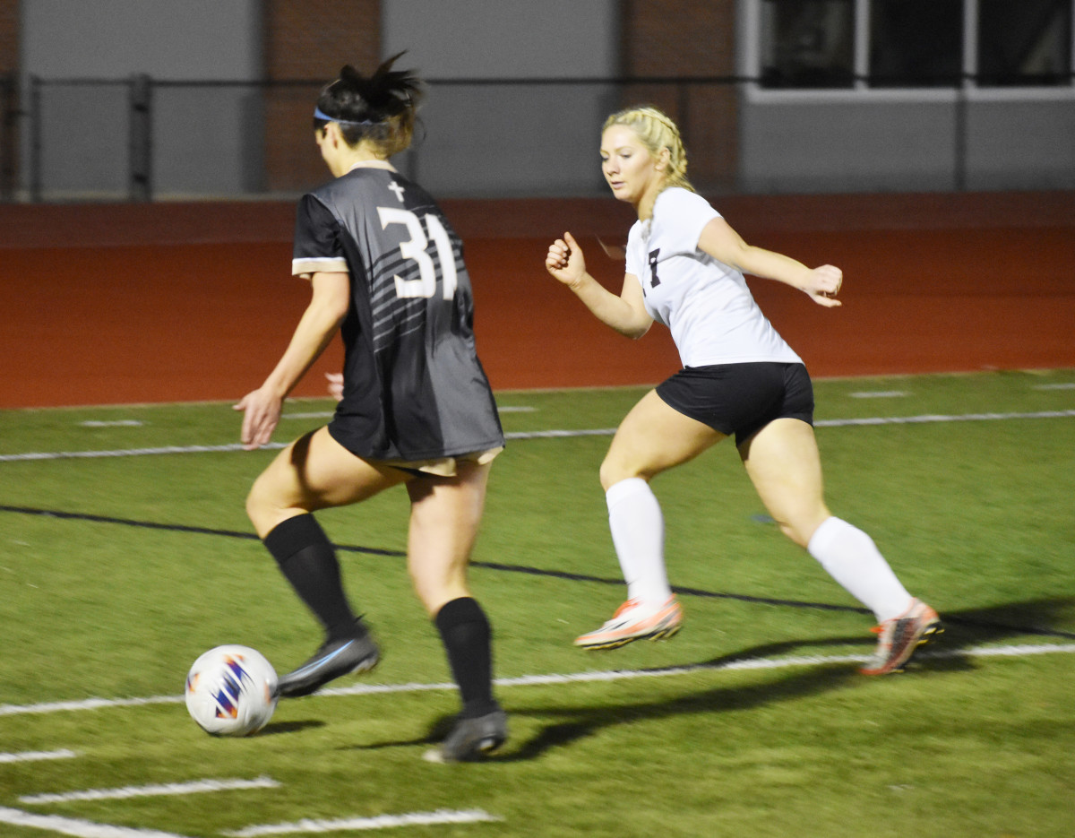 Bishop Moore's Sienna Rivera (31) works the ball against Astronaut's Skyler Brown on Tuesday night in a Class 4A, Region 2 quarterfinal. The Hornets won 9-0 -- their 15th shutout of the season.
