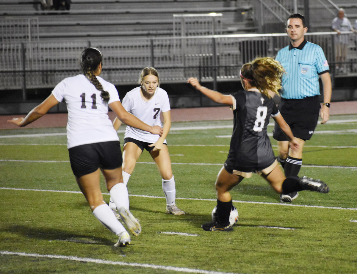 Bishop Moore's Gabby Garcia (8) works on dribbling through the Astronaut defense on Tuesday night in a Class 4A, Region 2 quarterfinal. The top-ranked Hornets won 9-0.