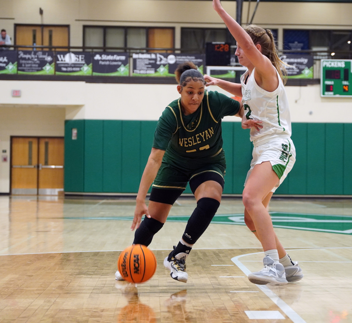 Desiree Davis drives toward the basket and puts pressure on the Dragonettes' defense. Davis and her teammates did damage close to the basket early and often in the team's 58-46 win.