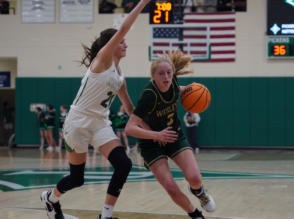 Wesleyan junior Eva Garabadian blows past her defender in route to the basket in the second half of Tuesday's game. Garabadian knocked down shots from both close and three-point range to contribute her 12 points to her team's win.