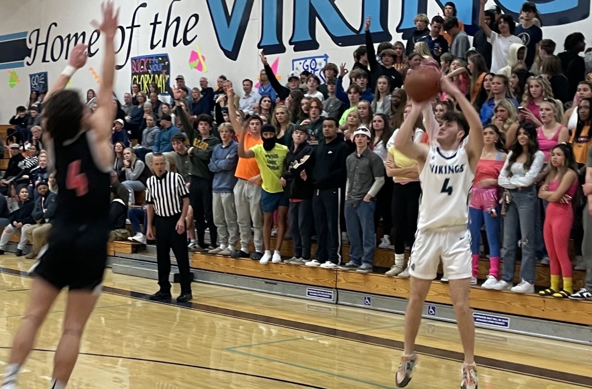Pleasant Valley's Hayden Rick (4) takes 3-pointer in front of the Vikings' student body on Homecoming last week. Rick leads the Vikings in 3-point percentage at 45 (25 of 55). Photo: Justin Couchot