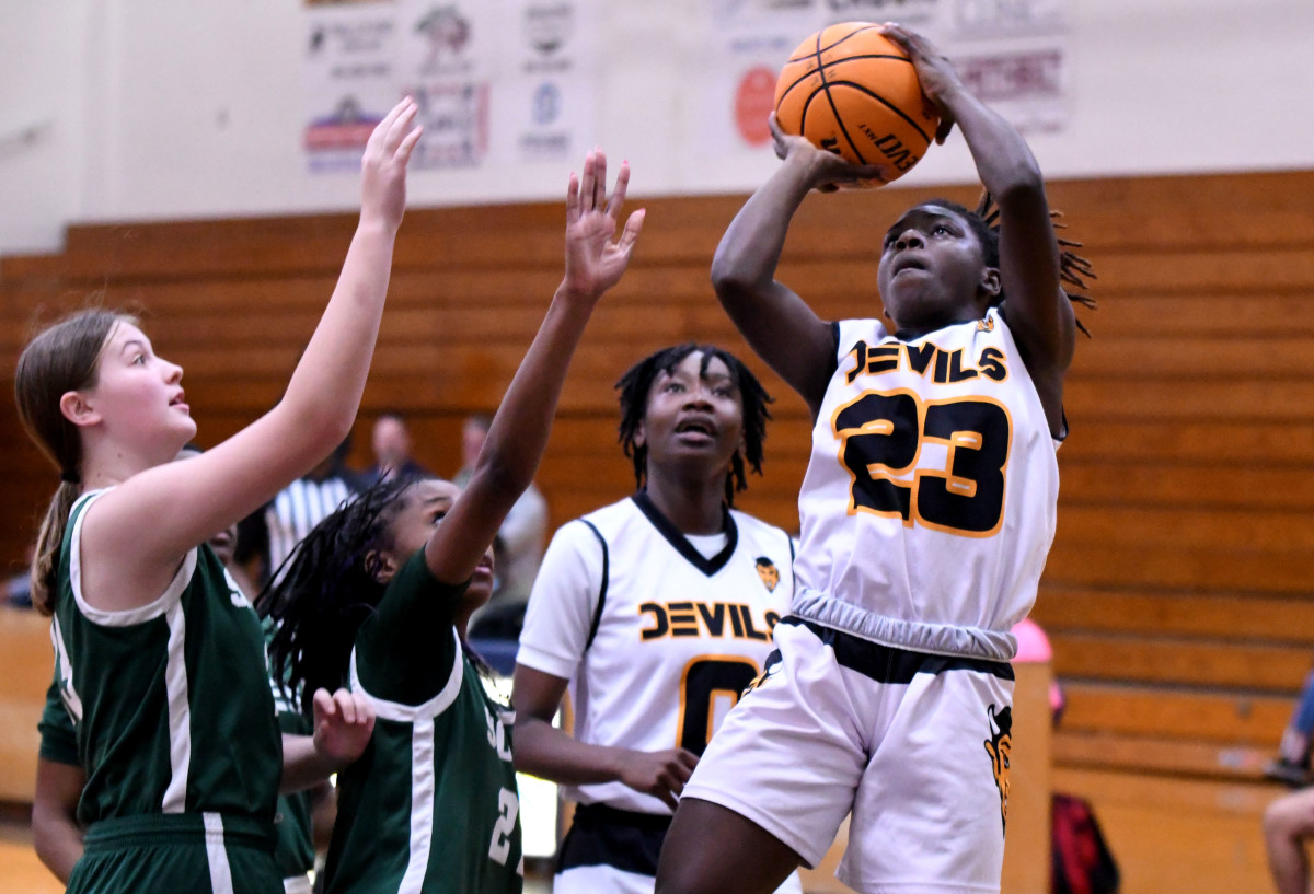Winter Haven senior guard Bre’Asia Washingnton goes up for a shot during the second quarter of a girls basketball Class 7A regional quarterfinal against Tampa Sickles on Thursday at Winter Haven.