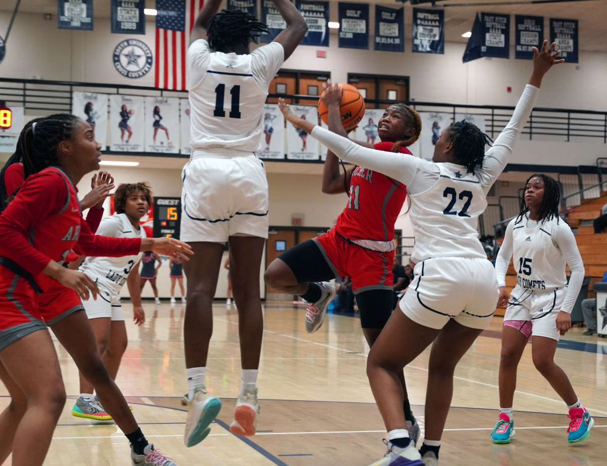 Kyndal Sessions shot: Facing multiple aggressive defenders, Kyndall Sessions gets up a shot in the first half of Archer's win over South Gwinnett.